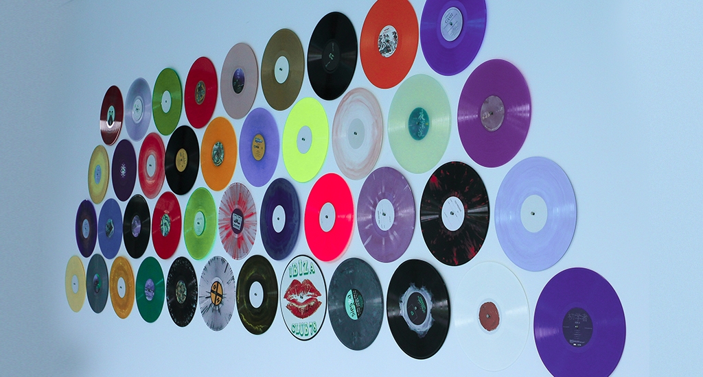 Vinyl records wall of purple media company